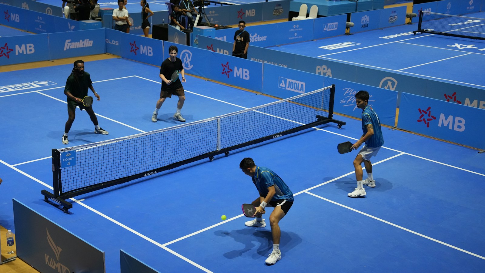 Players on a pickleball venue court